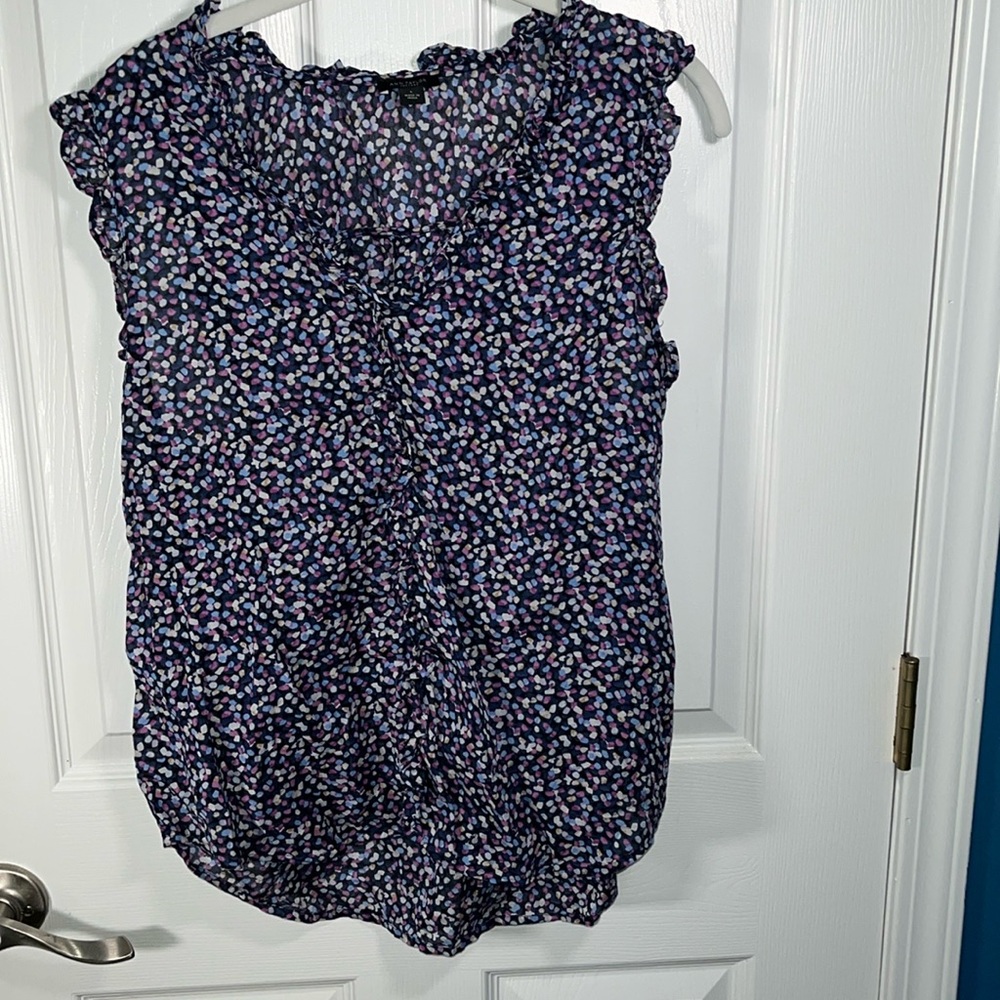 Ann Taylor sleeveless blouse with ruffle detail in the front/neck size large